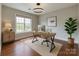 Bright home office featuring modern desk, stylish lighting, and large window with view at 4926 Trayton Ave, Gastonia, NC 28056