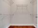 A walk-in closet with shelving and beautiful wood flooring, adding organization and style at 4926 Trayton Ave, Gastonia, NC 28056