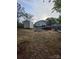A large backyard featuring gravel ground covering and a storage shed at 522 Pennsylvania Ave, Charlotte, NC 28216