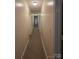 Bright hallway featuring neutral paint, multiple doors, and recessed lighting at 522 Pennsylvania Ave, Charlotte, NC 28216