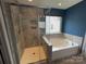 Bathroom with a glass enclosed shower and separate soaking tub at 5619 Fenway Dr, Charlotte, NC 28273