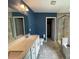 Updated bathroom with double sinks, walk-in shower, and tile flooring at 5619 Fenway Dr, Charlotte, NC 28273