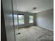 Bedroom featuring carpet, two windows and light-colored walls at 5619 Fenway Dr, Charlotte, NC 28273