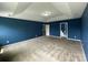 Spacious bedroom with tray ceilings, neutral carpet and an open doorway at 5619 Fenway Dr, Charlotte, NC 28273