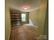 Empty bedroom with neutral carpet, a built-in desk, and ample natural light at 5619 Fenway Dr, Charlotte, NC 28273