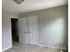 Bedroom features carpet, neutral walls, and double-door closet at 5619 Fenway Dr, Charlotte, NC 28273