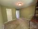 Bedroom with neutral carpet and a built-in shelving unit at 5619 Fenway Dr, Charlotte, NC 28273