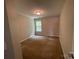 Cozy bedroom features carpet, a single window, and neutral paint at 5619 Fenway Dr, Charlotte, NC 28273