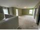 Large bonus room with great natural light, creating a versatile space for various activities at 5619 Fenway Dr, Charlotte, NC 28273