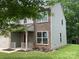 Beautiful home with a stone facade, well-manicured lawn, and attractive curb appeal at 5619 Fenway Dr, Charlotte, NC 28273