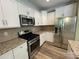 Modern kitchen featuring stainless steel appliances and granite countertops at 5619 Fenway Dr, Charlotte, NC 28273