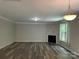 Spacious living room featuring a fireplace and sliding glass doors, with views to the outdoor space at 5619 Fenway Dr, Charlotte, NC 28273