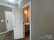 Stylish powder room with pedestal sink and decorative lighting, offering convenience for guests at 5619 Fenway Dr, Charlotte, NC 28273
