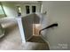 Stairway with wood handrail connecting the upper and lower levels of the home at 5619 Fenway Dr, Charlotte, NC 28273