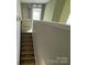 Carpeted stairway with handrail leading to the upper level, ensuring safety and comfort at 5619 Fenway Dr, Charlotte, NC 28273