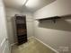 Walk-in closet featuring built-in shelves and ample hanging space, providing convenient storage at 5619 Fenway Dr, Charlotte, NC 28273