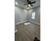 Bright bedroom with modern flooring, a ceiling fan, and lots of light from the window at 567 5Th St, Chester, SC 29706