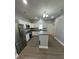 Modern kitchen with stainless steel appliances, gray countertops, and white cabinets at 567 5Th St, Chester, SC 29706