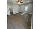 Bright living room with sleek flooring, fresh paint, and ample natural light from the window at 567 5Th St, Chester, SC 29706