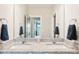 Bathroom vanity featuring dual sinks and granite countertops at 5712 Runnel Way, Charlotte, NC 28215