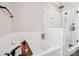 Modern tub featuring a glass-enclosed shower with built-in shelves, perfect for relaxation at 5712 Runnel Way, Charlotte, NC 28215