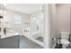 Bathroom featuring a double sink, a glass-enclosed shower, and a soaking tub at 5712 Runnel Way, Charlotte, NC 28215