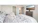Comfortable bedroom with soft bedding, dresser, and a bathroom visible through an open door at 5712 Runnel Way, Charlotte, NC 28215