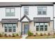 Attractive brick and vinyl townhome with covered entry and landscaped yard at 5712 Runnel Way, Charlotte, NC 28215