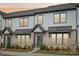Attractive brick and vinyl townhome with covered entry and landscaped yard at 5712 Runnel Way, Charlotte, NC 28215