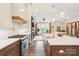 Stylish kitchen with a large island, stainless steel range, and views into the living room at 5712 Runnel Way, Charlotte, NC 28215