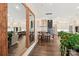 Open living space featuring hardwood floors and view to the kitchen and dining area at 5712 Runnel Way, Charlotte, NC 28215