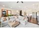Open concept living room flowing into the kitchen featuring hardwood floors and neutral decor at 5712 Runnel Way, Charlotte, NC 28215