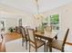 Inviting dining room featuring a wooden table, upholstered chairs, and an elegant chandelier at 5817 Portburn Rd, Charlotte, NC 28211