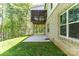 Home exterior shows expansive yard, screened porch, and brick detailing at 602 Kames Nw Ct, Conover, NC 28613