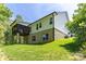 Exterior of home with a spacious backyard, screened porch, and brick foundation at 602 Kames Nw Ct, Conover, NC 28613