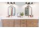 Bright bathroom featuring double sinks with modern fixtures, a clean design, and stylish mirrors at 602 Kames Nw Ct, Conover, NC 28613