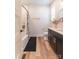 Modern bathroom with a sleek black vanity, stylish fixtures, and a shower-tub combination at 602 Kames Nw Ct, Conover, NC 28613