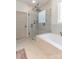 Modern bathroom featuring a glass-enclosed shower with a soaking tub and marble accents at 602 Kames Nw Ct, Conover, NC 28613