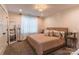 Comfortable bedroom with a soft carpet, a large window and a light neutral aesthetic at 602 Kames Nw Ct, Conover, NC 28613