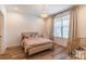 Cozy bedroom with a charming chandelier, bright window, and a crib, perfect for a Bedroom at 602 Kames Nw Ct, Conover, NC 28613