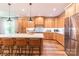 A kitchen with wood cabinets, stainless steel appliances, and a large island with seating at 602 Kames Nw Ct, Conover, NC 28613