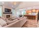 Spacious living room with fireplace, TV, and comfortable seating perfect for relaxing or entertaining at 602 Kames Nw Ct, Conover, NC 28613