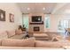 Bright living area featuring a fireplace, windows, and cozy seating arrangements, ideal for gatherings at 602 Kames Nw Ct, Conover, NC 28613