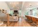 Bright open space featuring a modern kitchen, fireplace, and seamless flow to dining and living areas at 602 Kames Nw Ct, Conover, NC 28613