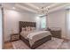 Main bedroom with a tray ceiling, decorative lighting, and neutral tones, creating a peaceful ambiance at 602 Kames Nw Ct, Conover, NC 28613