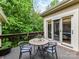 Inviting back deck features an outdoor dining area and sliding glass doors to the home's interior at 6645 Gaywind Dr, Charlotte, NC 28226