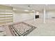 Spacious basement with neutral carpet, built-in shelving, and convenient wet bar area for entertaining at 6645 Gaywind Dr, Charlotte, NC 28226