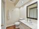 Bathroom with toilet, sink, shower stall, and hardwood floors at 6645 Gaywind Dr, Charlotte, NC 28226