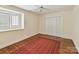 Bedroom features hardwood floors, white trim and a double door closet at 6645 Gaywind Dr, Charlotte, NC 28226