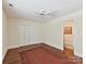 Bedroom with hardwood floors, a neutral color palette, and closet space at 6645 Gaywind Dr, Charlotte, NC 28226